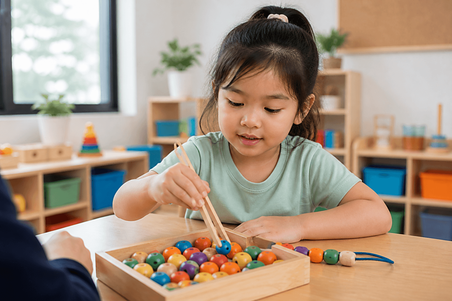 Child threading beads in occupational therapy